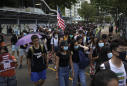 Shot teen charged as Hong Kong considers ban on masks