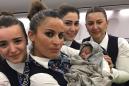 Airline crew casually help woman deliver a baby 42,000 feet in the air