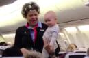 Southwest flight attendant walks plane aisle with baby to give tired mother a break