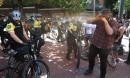 Portland police clash with protesters and make 'cement milkshake' claim