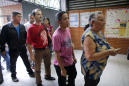 The Latest: Venezuela polling stations being kept open late