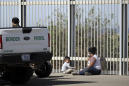 Advance guard of caravan reaches U.S. border — and waits
