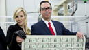 Millionaire Treasury Secretary, Socialite Wife Pose With Sheets Of Cash