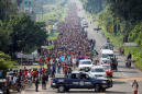 Thousands of Hondurans in U.S.-bound migrant caravan head into Mexico