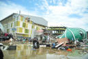 The Latest: Over 800 dead in Indonesia quake and tsunami