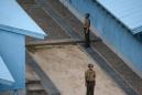 Two Koreas remove landmines at tense border
