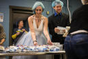 Couple weds at charity that brought them together, packs meals for hungry kids after exchanging vows