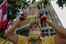 Thai protesters defy police water cannons to deliver letters