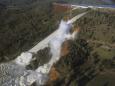 Officials to stop California dam's outflow to clear debris