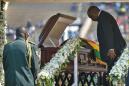 Jeered over attacks, S.Africa's president apologises at Mugabe funeral