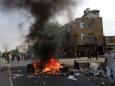 The Latest: Curfews imposed in some Iraqi cities amid unrest
