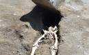 Skeleton of Roman beheaded by giant flying rock slab found at Pompeii