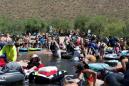 Crowds pack Arizona river as U.S. posts record COVID cases for three days running