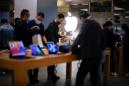 Apple shares fall as iPhone sales dip weighs on record quarterly results