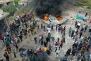 Syrians in Idlib protest opening of trade link with regime