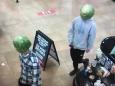 Two men caught stealing from convenience store with watermelons on their heads