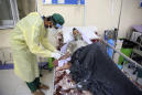 Families step in at Kabul COVID-19 ward to care for patients