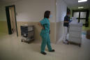 AP PHOTOS: Virus ward doctor runs from dawn to dark in Italy