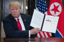 Trump and Kim sign joint statement promising 'complete denuclearization of the Korean Peninsula'