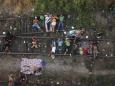 The Latest: Migrant caravan advances after police blockade