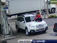 Woman jumps onto the hood of moving car to prevent carjacking at petrol station