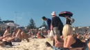 Dude's hack for walking on hot sand is clever, if odd