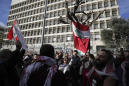 Protesters march in Lebanon to reject new government