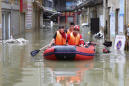 People stranded on rooftops by rain, flooding in China