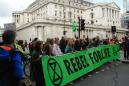 U.K. Set to Delay Green Finance Plan Amid Debate on Ambition