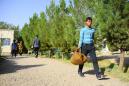 Afghans return home in record numbers as Iran currency plunges