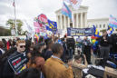Divided Supreme Court weighs LGBT people's rights