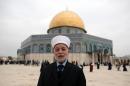Israeli forces detain Jerusalem's top Muslim cleric after attack: son