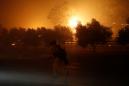 Hundreds told to flee, almost 200,000 without power in California wildfires