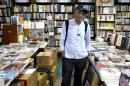 Hong Kong dissident reopens bookshop in Taiwan, defying Beijing
