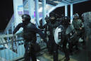 Hong Kong police in standoff with protesters after sit-in