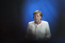 Germany's Merkel sits for anthems after shaking episodes