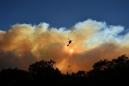Firefighters battle blazes on two fronts in California, 44 dead