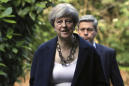Tottering Theresa May names new UK Cabinet as critics circle