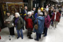The Latest: High turnout delays caucus at big Iowa precinct
