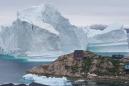 Massive 11-million-ton iceberg towers over little village in Greenland
