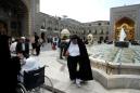 Iran closes key religious sites as virus death toll hits 853