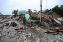Indonesia rescuers scramble to reach isolated tsunami-struck towns
