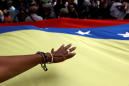 Venezuela seeks to restore power amid looting; China offers help