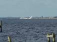 Charter plane in Florida river at end of runway