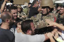 Lebanese army opens roads closed by protesters amid scuffles