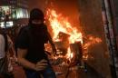 Hong Kong ban on masks sparks violent clashes, rail shutdown