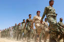Syrian, Iraqi forces say U.S. bombs military border positions, U.S. denies
