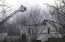 The Latest: News conference planned on mansion fire