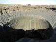 A massive 164-feet deep crater suddenly opened up on Siberia's Arctic tundra and it could be the result of an explosion triggered by climate change, scientists say