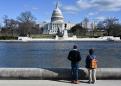 Shutdown puts some programs on hold, but most government agencies continue running